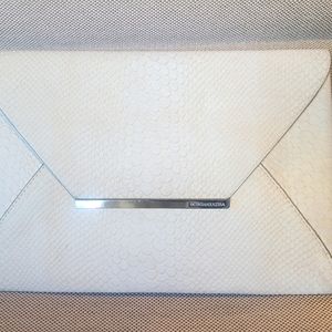 BCBG MaxAzria white "snake-skin" clutch